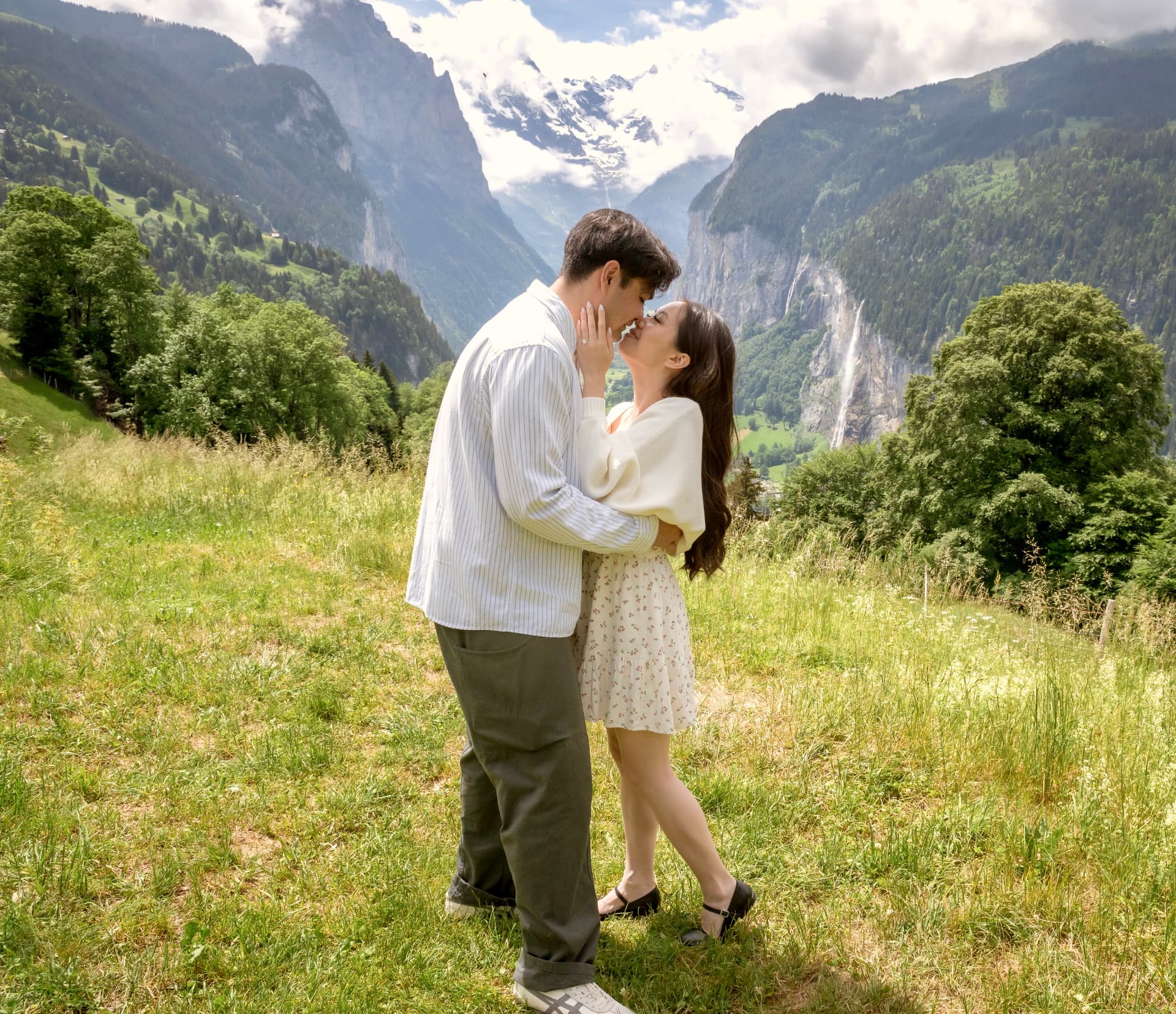 Sheryl and Samit sharing a kiss in the Swiss mountains